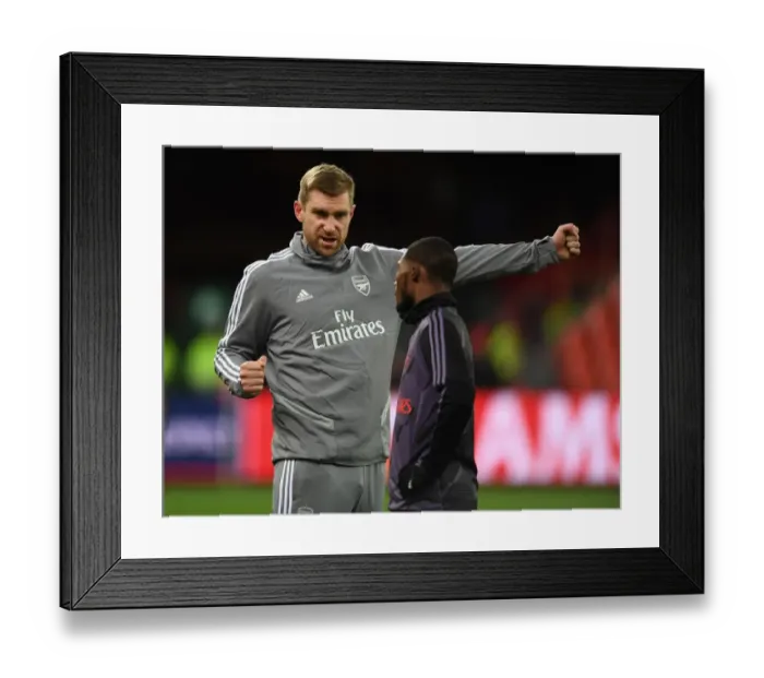 Framed Print : Arsenal's Mertesacker Coaches Maitland-Niles Ahead of Standard Liege Clash (UEFA Europa League) Framed Print : Arsenal's Mertesacker Coaches Maitland-Niles Ahead of Standard Liege Clash (UEFA Europa League)