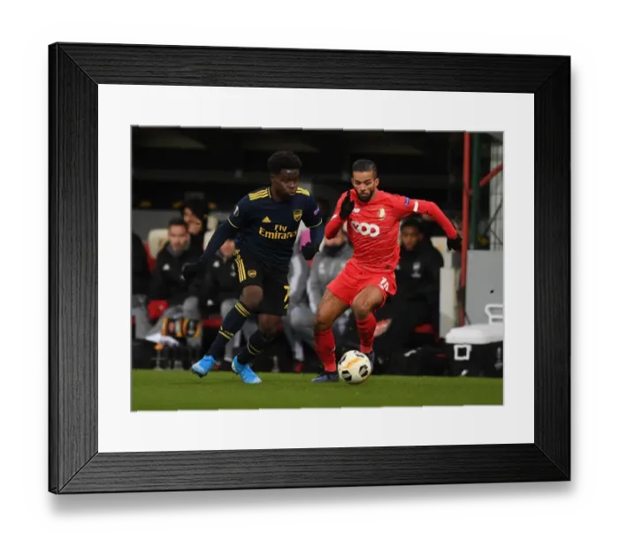 Framed Print : Bukayo Saka vs. Mehdi Carcela: A Europa League Showdown at Standard Liege