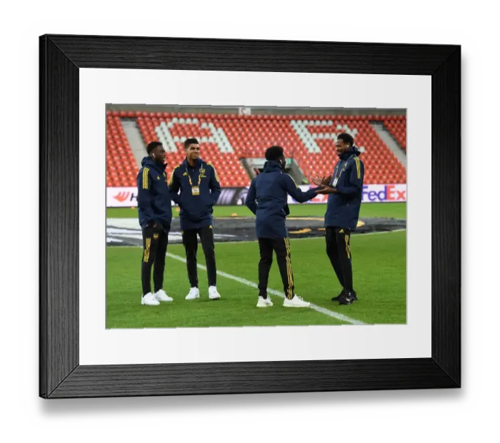 Framed Print : Arsenal Players Inspect Europa League Pitch at Standard Liege Ahead of Showdown