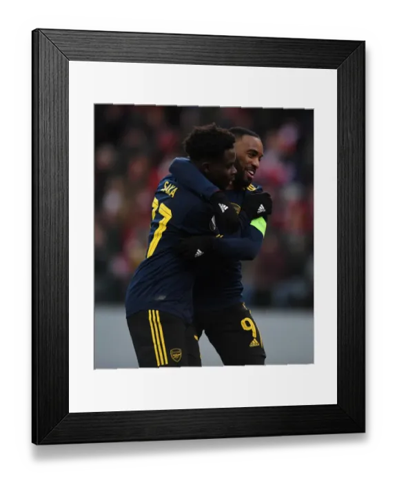 Framed Print : Arsenal's Saka and Lacazette: Celebrating Goals in Europa League Victory over Standard Liege Framed Print : Arsenal's Saka and Lacazette: Celebrating Goals in Europa League Victory over Standard Liege
