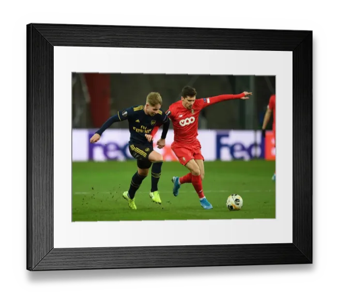 Framed Print : Emile Smith Rowe Clashes with Gojko Cimirot in Arsenal's UEFA Europa League Battle against Standard Liege