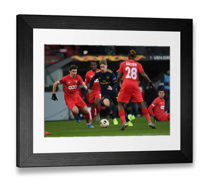 Framed Print : Emile Smith Rowe Clashes with Gojko Cimirot in Standard Liege vs. Arsenal UEFA Europa League Match