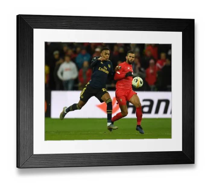 Framed Print : Joe Willock Closes In: Arsenal's Europa League Battle Against Standard Liege