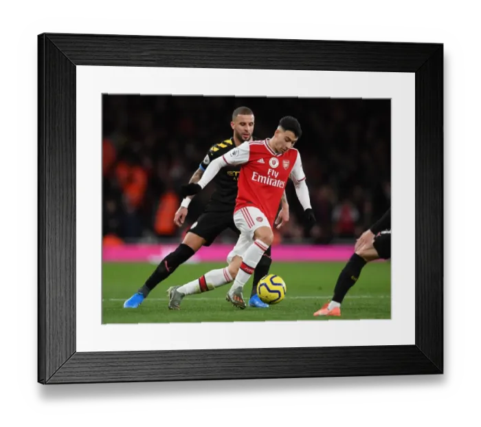 Framed Print : Martinelli vs. Walker: A Fiery Battle in Arsenal's Premier League Showdown against Manchester City