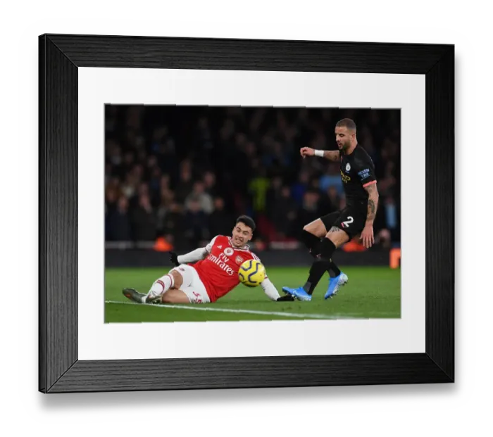 Framed Print : Arsenal's Martinelli Faces Off Against Manchester City's Walker in Premier League Showdown Framed Print : Arsenal's Martinelli Faces Off Against Manchester City's Walker in Premier League Showdown