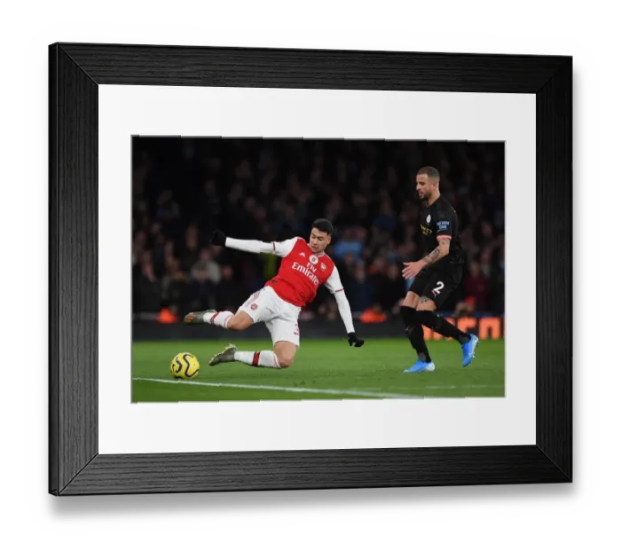 Framed Print : Martinelli vs. Walker: A Fierce Battle in Arsenal vs. Manchester City Premier League Showdown Framed Print : Martinelli vs. Walker: A Fierce Battle in Arsenal vs. Manchester City Premier League Showdown