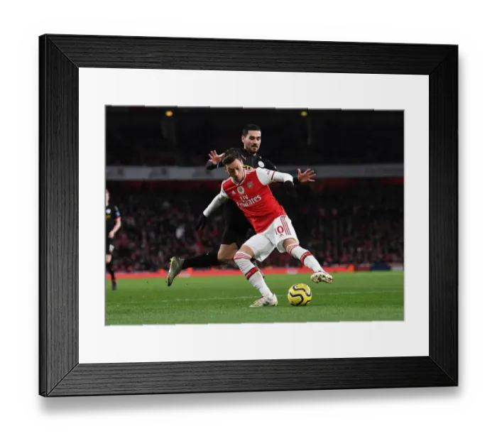 Framed Print : Intense Rivalry: Ozil vs. Gundogan - Arsenal vs. Manchester City Showdown Framed Print : Intense Rivalry: Ozil vs. Gundogan - Arsenal vs. Manchester City Showdown