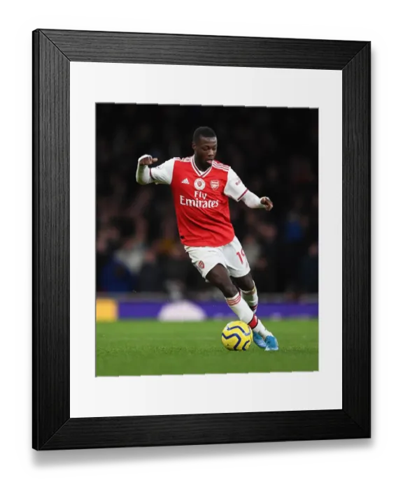 Framed Print : Arsenal's Nicolas Pepe Faces Manchester City in the Premier League