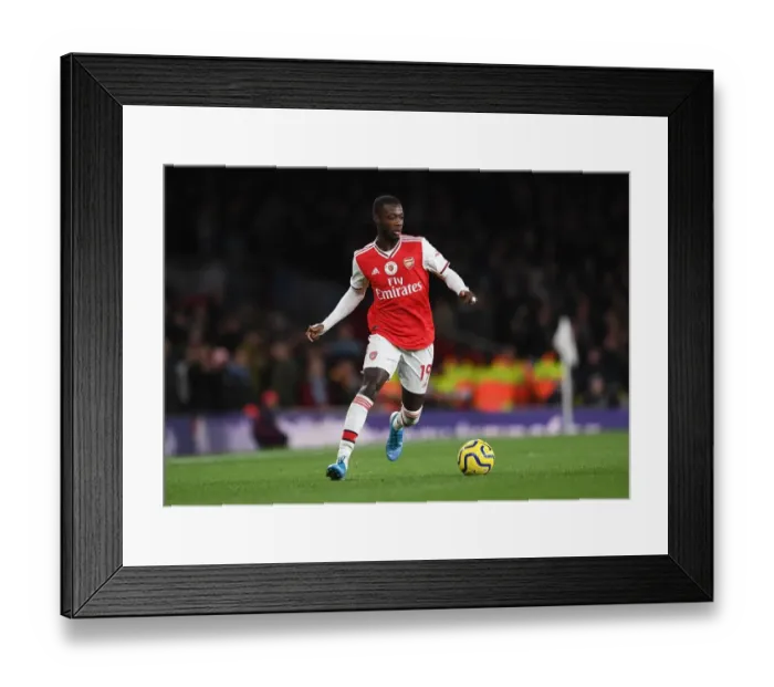 Framed Print : Pepe vs Manchester City: Arsenal's Star Forward Faces Off in Premier League Showdown