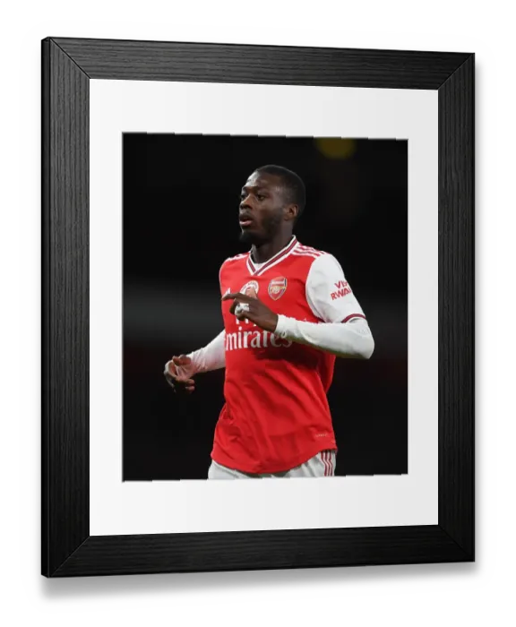 Framed Print : Arsenal's Nicolas Pepe Goes Head-to-Head with Manchester City in the Premier League Framed Print : Arsenal's Nicolas Pepe Goes Head-to-Head with Manchester City in the Premier League