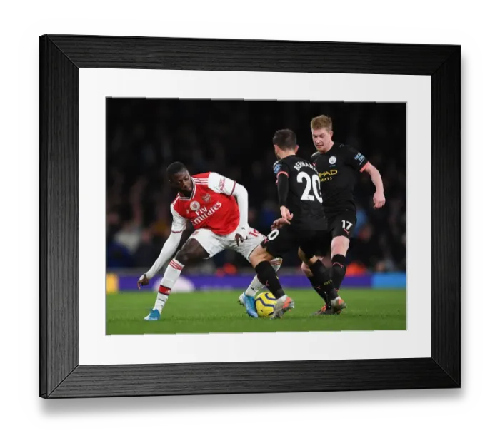 Framed Print : Arsenal vs Manchester City: Pepe Takes on De Bruyne and Silva in Premier League Clash (December 2019)
