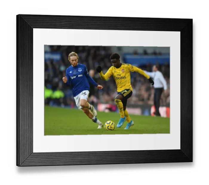 Framed Print : Saka vs. Davies: Everton vs. Arsenal, Premier League Showdown (December 2019)