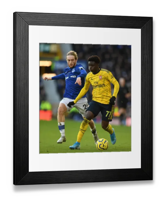 Framed Print : Saka vs. Davies: A Premier League Showdown - Arsenal vs. Everton (December 2019) Framed Print : Saka vs. Davies: A Premier League Showdown - Arsenal vs. Everton (December 2019)