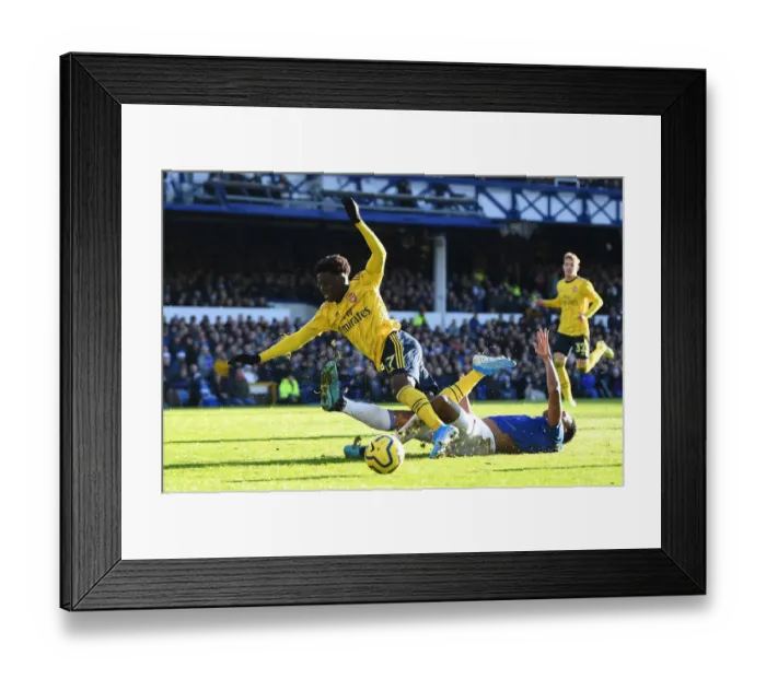 Framed Print : Saka vs Mina: A Premier League Battle at Goodison Park Framed Print : Saka vs Mina: A Premier League Battle at Goodison Park