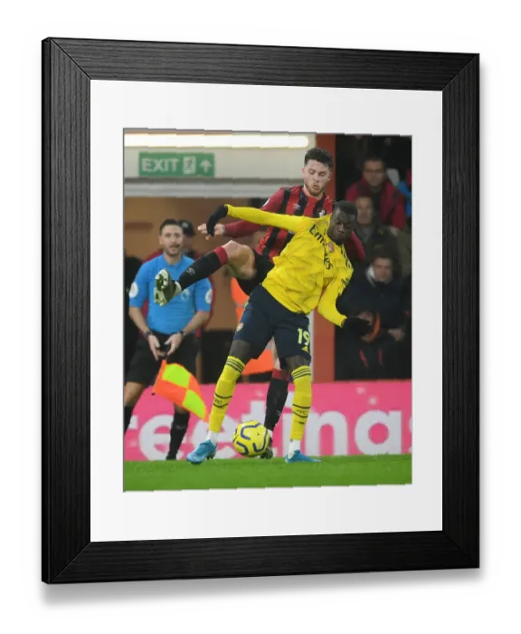 Framed Print : Pepe vs Simpson: A Premier League Showdown - Arsenal's Nicolas Pepe Faces Off Against Bournemouth's Jack Simpson Framed Print : Pepe vs Simpson: A Premier League Showdown - Arsenal's Nicolas Pepe Faces Off Against Bournemouth's Jack Simpson