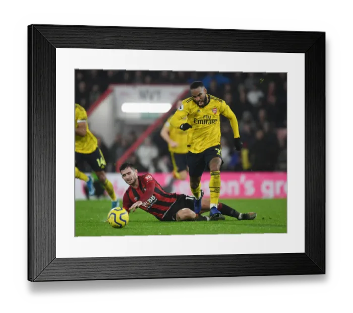 Framed Print : Arsenal's Alex Lacazette Brakes Past Bournemouth's Lewis Cook in Premier League Clash (AFC Bournemouth v Arsenal 2019-20)