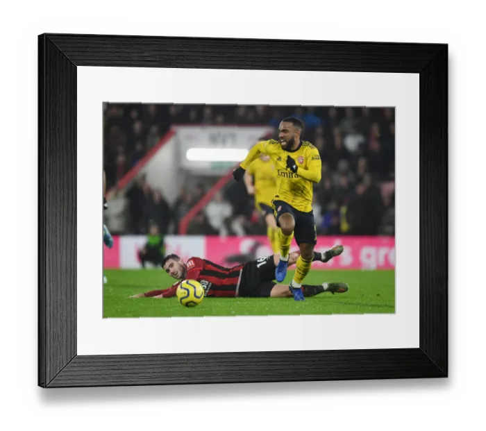 Framed Print : Alexis Lacazette's Slick Moves: Outsmarting Lewis Cook in Arsenal's Premier League Victory (December 2019) Framed Print : Alexis Lacazette's Slick Moves: Outsmarting Lewis Cook in Arsenal's Premier League Victory (December 2019)
