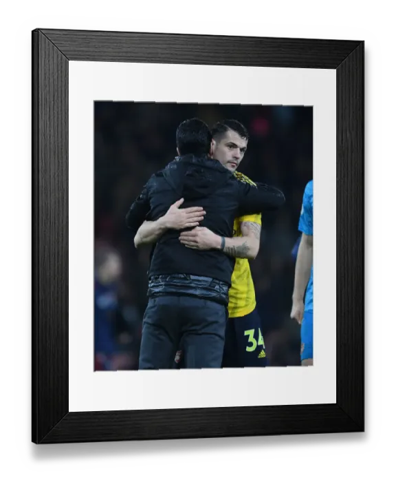 Framed Print : Mikel Arteta Consoles Distressed Granit Xhaka: A Moment of Comfort After Arsenal's Win at Bournemouth