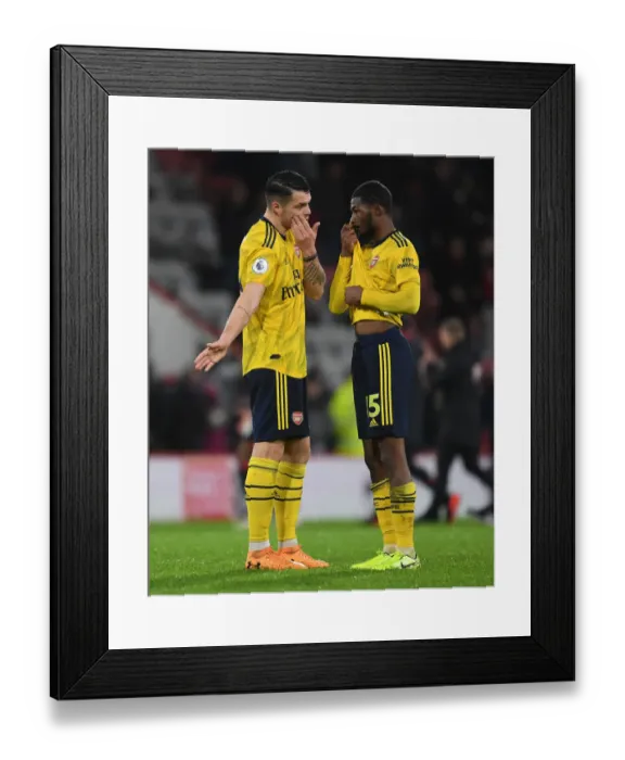 Framed Print : Arsenal's Xhaka and Maitland-Niles Share a Moment after AFC Bournemouth Clash (Premier League 2019-20)