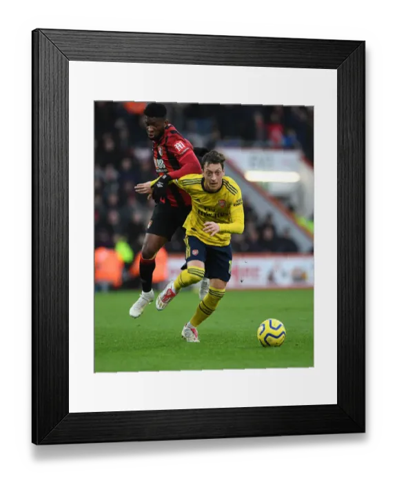 Framed Print : Mesut Ozil Clashes with Jefferson Lerma: AFC Bournemouth vs Arsenal FC, Premier League 2019-20 Framed Print : Mesut Ozil Clashes with Jefferson Lerma: AFC Bournemouth vs Arsenal FC, Premier League 2019-20