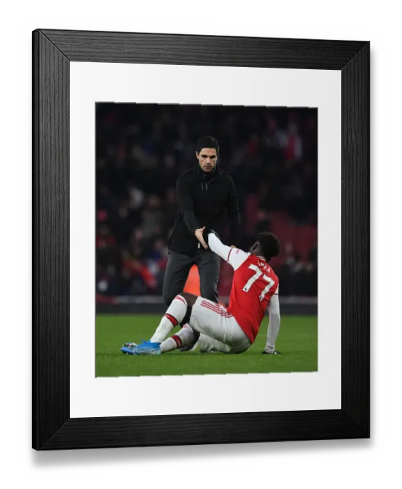 Framed Print : Mikel Arteta Comforts Distressed Bukayo Saka Amidst Arsenal-Chelsea Rivalry Framed Print : Mikel Arteta Comforts Distressed Bukayo Saka Amidst Arsenal-Chelsea Rivalry