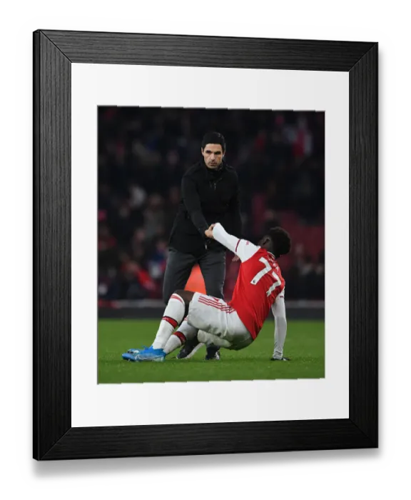 Framed Print : Mikel Arteta Consoles Distressed Bukayo Saka Amidst Arsenal's Defeat Framed Print : Mikel Arteta Consoles Distressed Bukayo Saka Amidst Arsenal's Defeat
