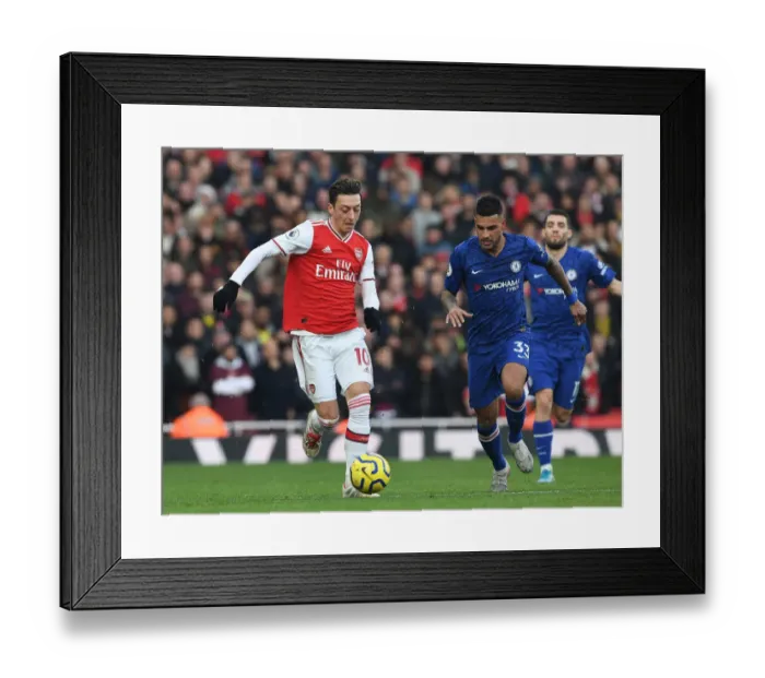Framed Print : Ozil vs. Emerson: A Premier League Showdown at the Emirates Framed Print : Ozil vs. Emerson: A Premier League Showdown at the Emirates