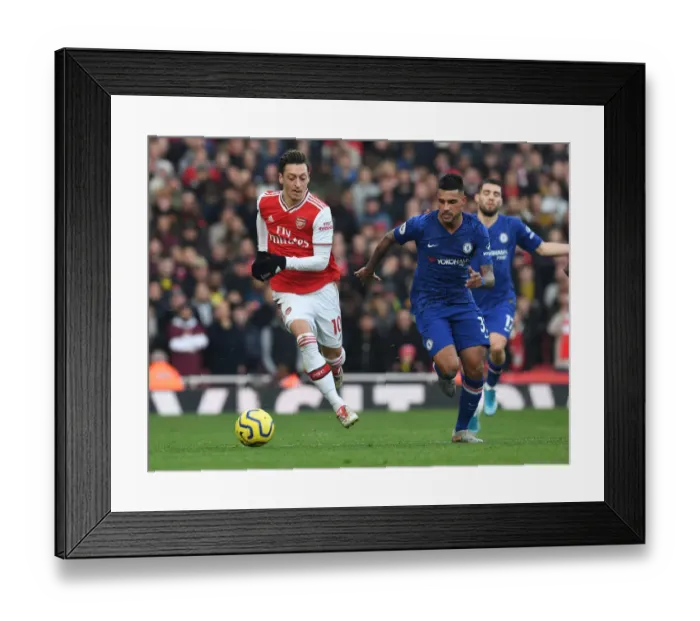Framed Print : Arsenal vs. Chelsea Showdown: Ozil vs. Emerson Battle at the Emirates