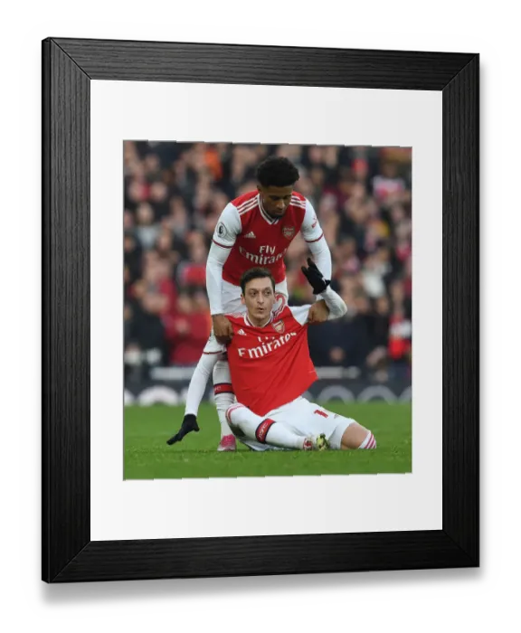 Framed Print : Arsenal's Ozil and Nelson: A Moment of Support Amidst Arsenal vs. Chelsea Rivalry (2019-20) Framed Print : Arsenal's Ozil and Nelson: A Moment of Support Amidst Arsenal vs. Chelsea Rivalry (2019-20)