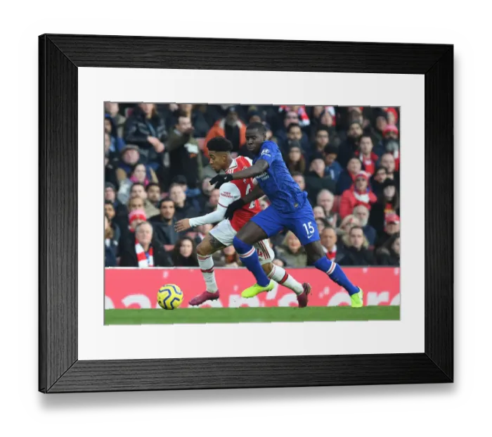 Framed Print : Arsenal vs. Chelsea: A Fiery Premier League Clash - Reiss Nelson vs. Kurt Zouma