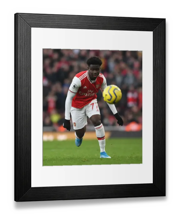 Framed Print : Arsenal's Bukayo Saka Goes Head-to-Head with Chelsea in Intense Premier League Showdown Framed Print : Arsenal's Bukayo Saka Goes Head-to-Head with Chelsea in Intense Premier League Showdown