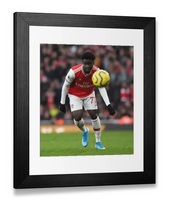 Framed Print : Arsenal's Bukayo Saka Faces Off Against Chelsea in Premier League Clash Framed Print : Arsenal's Bukayo Saka Faces Off Against Chelsea in Premier League Clash