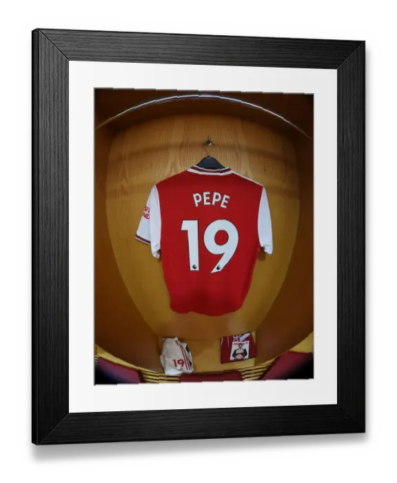 Framed Print : Arsenal FC vs Chelsea FC: Pepe's Hanging Shirt in Arsenal's Changing Room (Premier League 2019-20)