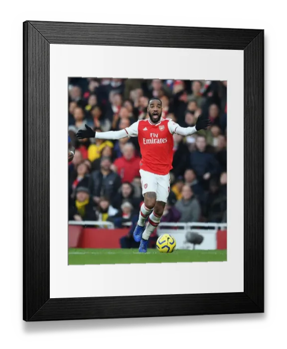 Framed Print : Arsenal's Alexandre Lacazette Goes Head-to-Head with Chelsea in Premier League Clash