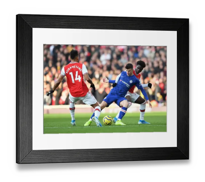 Framed Print : Arsenal vs. Chelsea: Saka and Aubameyang Clash in Intense Premier League Showdown