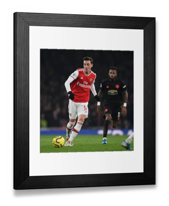 Framed Print : Arsenal vs. Manchester United: A Premier League Showdown - Ozil vs. Manchester United