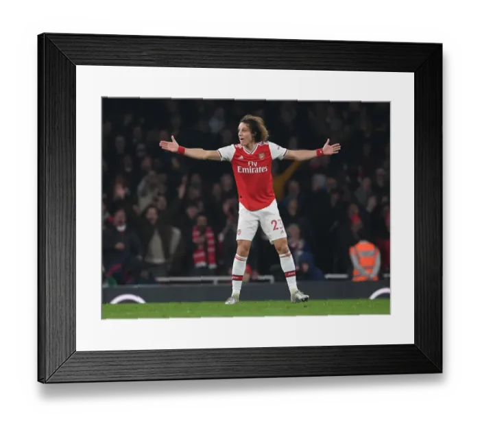 Framed Print : Arsenal's David Luiz Faces Off Against Manchester United in Premier League Showdown