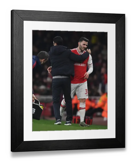 Framed Print : Arsenal's Mike Arteta Embraces Sead Kolasinac After Substitution vs Manchester United (Premier League, 2019-20) Framed Print : Arsenal's Mike Arteta Embraces Sead Kolasinac After Substitution vs Manchester United (Premier League, 2019-20)