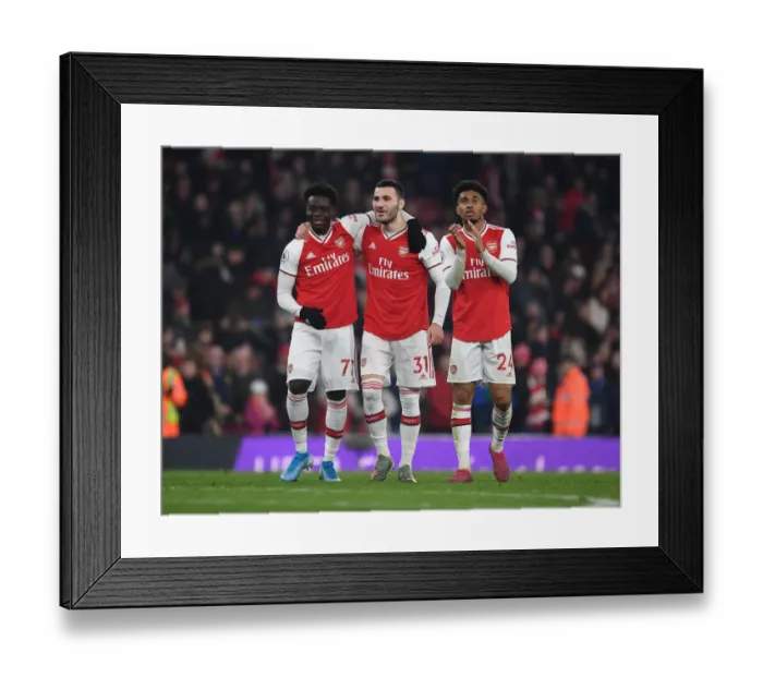 Framed Print : Arsenal Celebrate Hard-Fought Victory Over Manchester United in Premier League Showdown