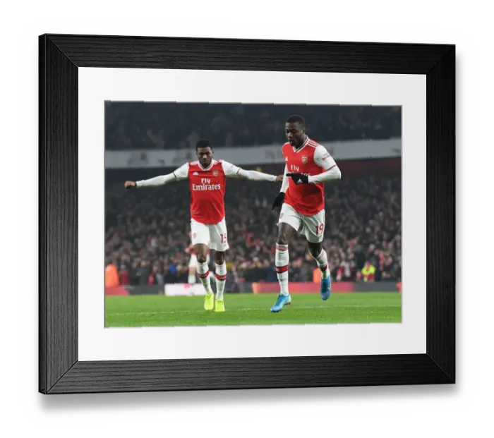 Framed Print : Nicolas Pepe's Stunner: Arsenal's First Goal vs Manchester United (2019-20) Framed Print : Nicolas Pepe's Stunner: Arsenal's First Goal vs Manchester United (2019-20)