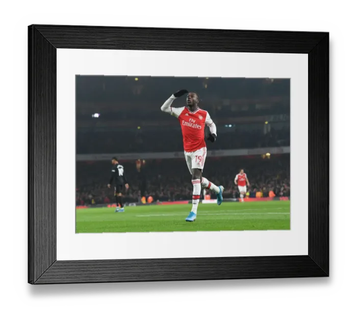 Framed Print : Nicolas Pepe Scores First Arsenal Goal: Arsenal's Triumph Over Manchester United in the 2020 Premier League