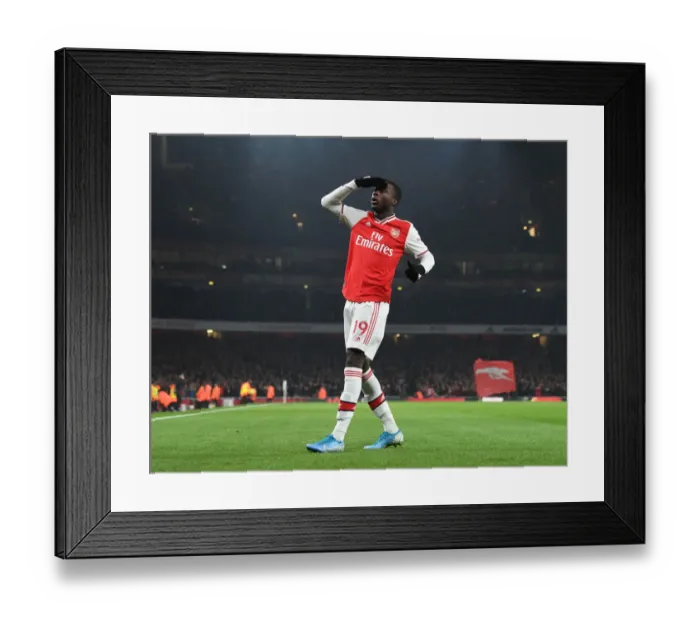 Framed Print : Nicolas Pepe Scores First Arsenal Goal Against Manchester United (2019-20) Framed Print : Nicolas Pepe Scores First Arsenal Goal Against Manchester United (2019-20)