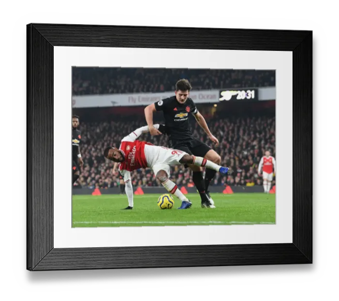 Framed Print : Arsenal vs Manchester United: Lacazette vs Maguire Clash in Premier League Showdown