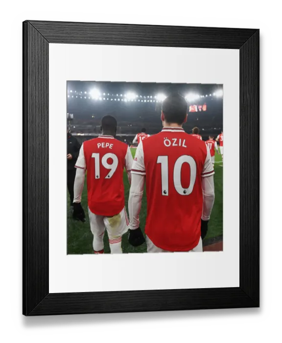 Framed Print : Half Time at Emirates: Pepe and Ozil of Arsenal Discuss Strategy with Manchester United (2019-20) Framed Print : Half Time at Emirates: Pepe and Ozil of Arsenal Discuss Strategy with Manchester United (2019-20)