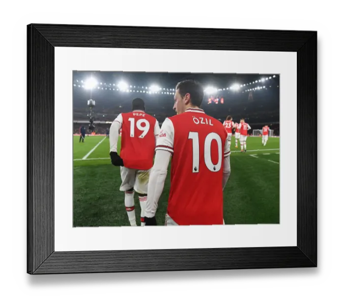Framed Print : Pepe vs Ozil: A Star-Studded Showdown at Arsenal's Battle against Manchester United (2019-20)