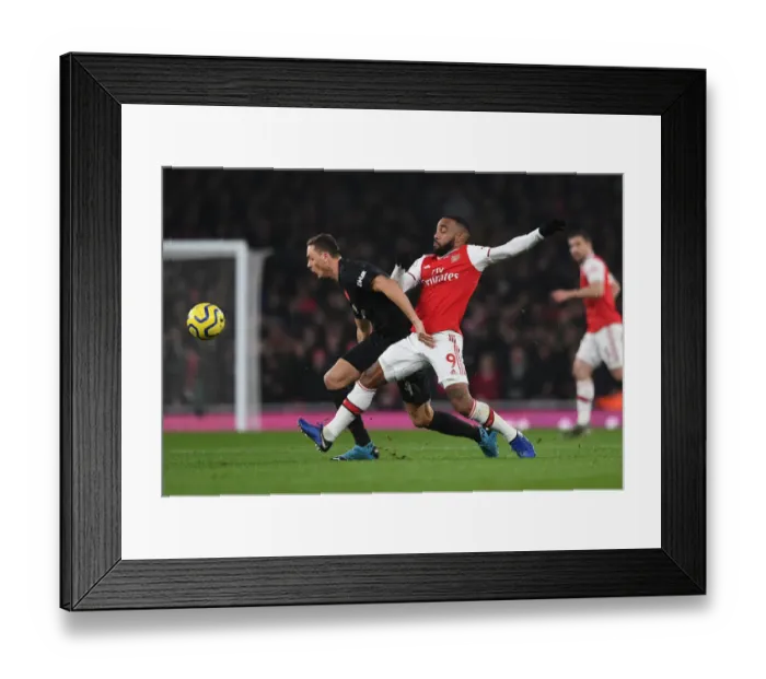Framed Print : Arsenal vs Manchester United: Lacazette Tackles Matic in Intense Premier League Clash (2019-20)