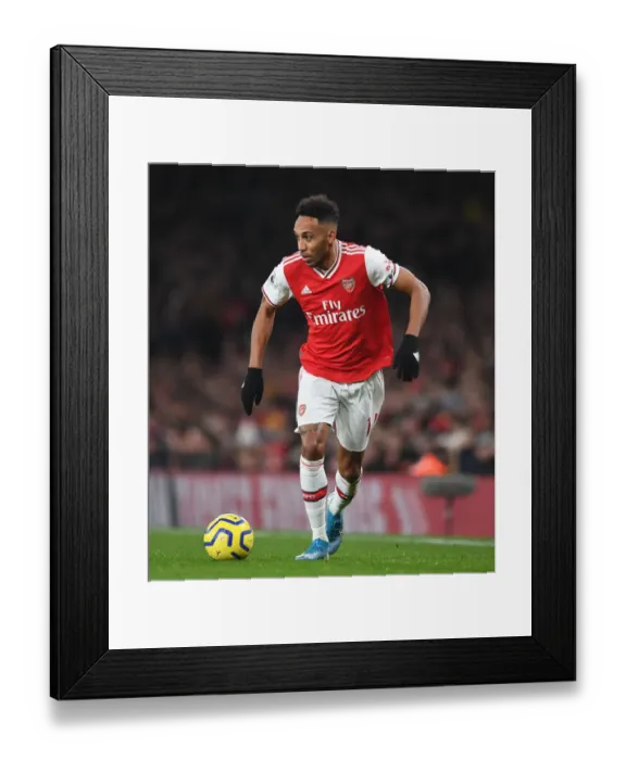 Framed Print : Arsenal's Aubameyang Faces Off Against Manchester United in Premier League Clash (2019-20) Framed Print : Arsenal's Aubameyang Faces Off Against Manchester United in Premier League Clash (2019-20)