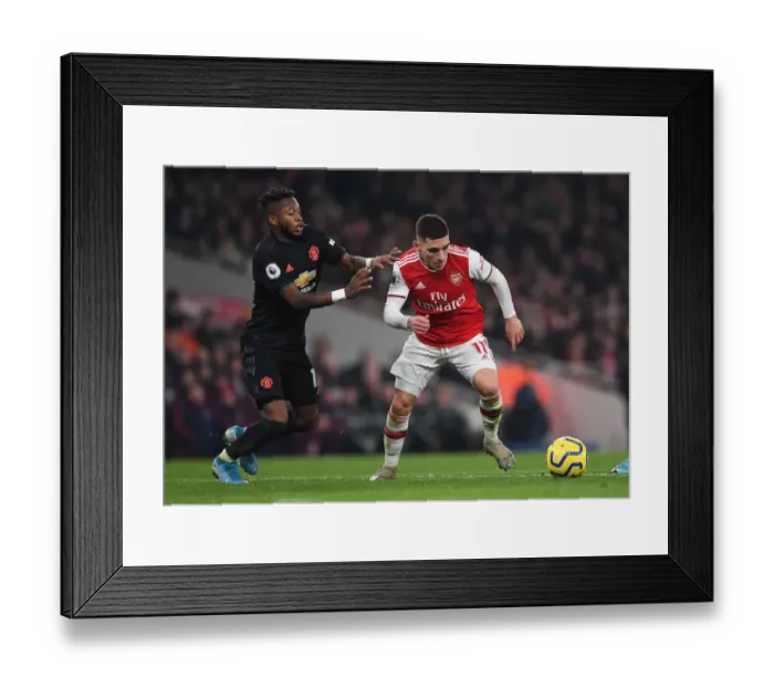 Framed Print : Arsenal's Torreira Clashes with Manchester United's Fred in Premier League Showdown Framed Print : Arsenal's Torreira Clashes with Manchester United's Fred in Premier League Showdown