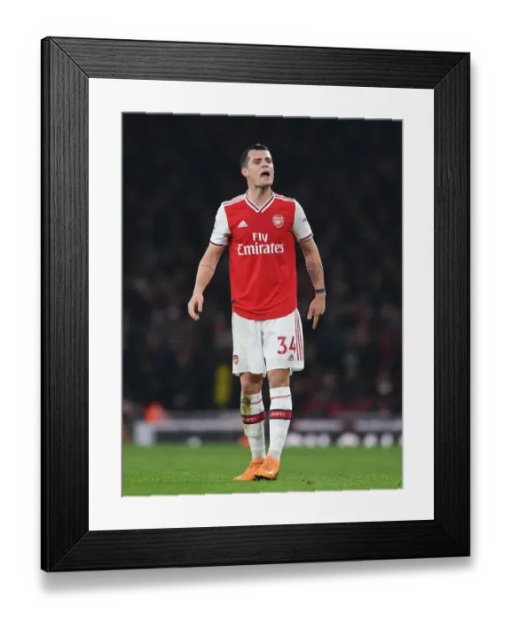 Framed Print : Arsenal's Granit Xhaka in Action Against Manchester United - Premier League 2019-2020 Framed Print : Arsenal's Granit Xhaka in Action Against Manchester United - Premier League 2019-2020