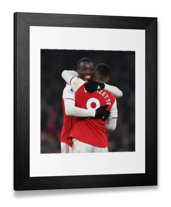 Framed Print : Arsenal's Double Act: Pepe and Lacazette Celebrate Goals Against Manchester United (2019-20) Framed Print : Arsenal's Double Act: Pepe and Lacazette Celebrate Goals Against Manchester United (2019-20)